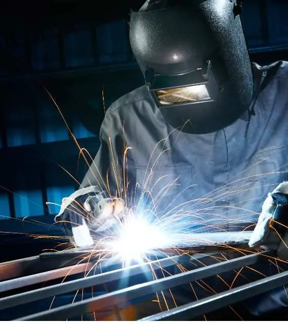 Welder performing metal fabrication at Precision Design Concepts